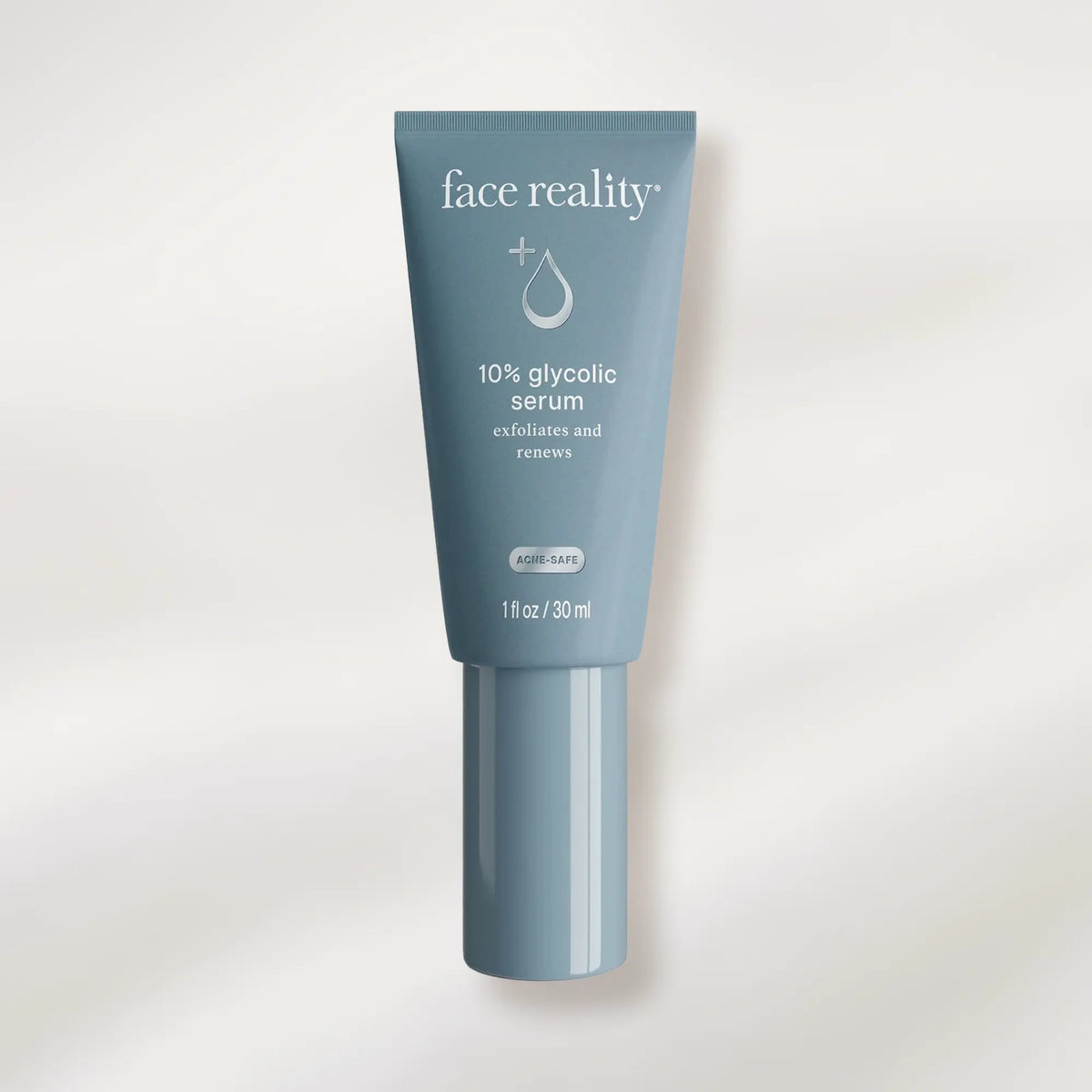 Tube of face reality 10% glycolic serum on a white background