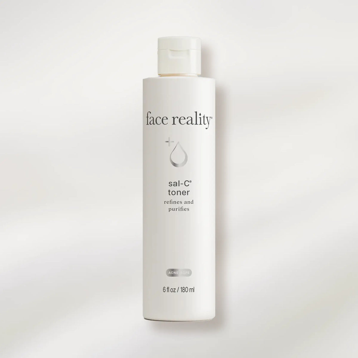 Face reality sai-C toner bottle on a white background