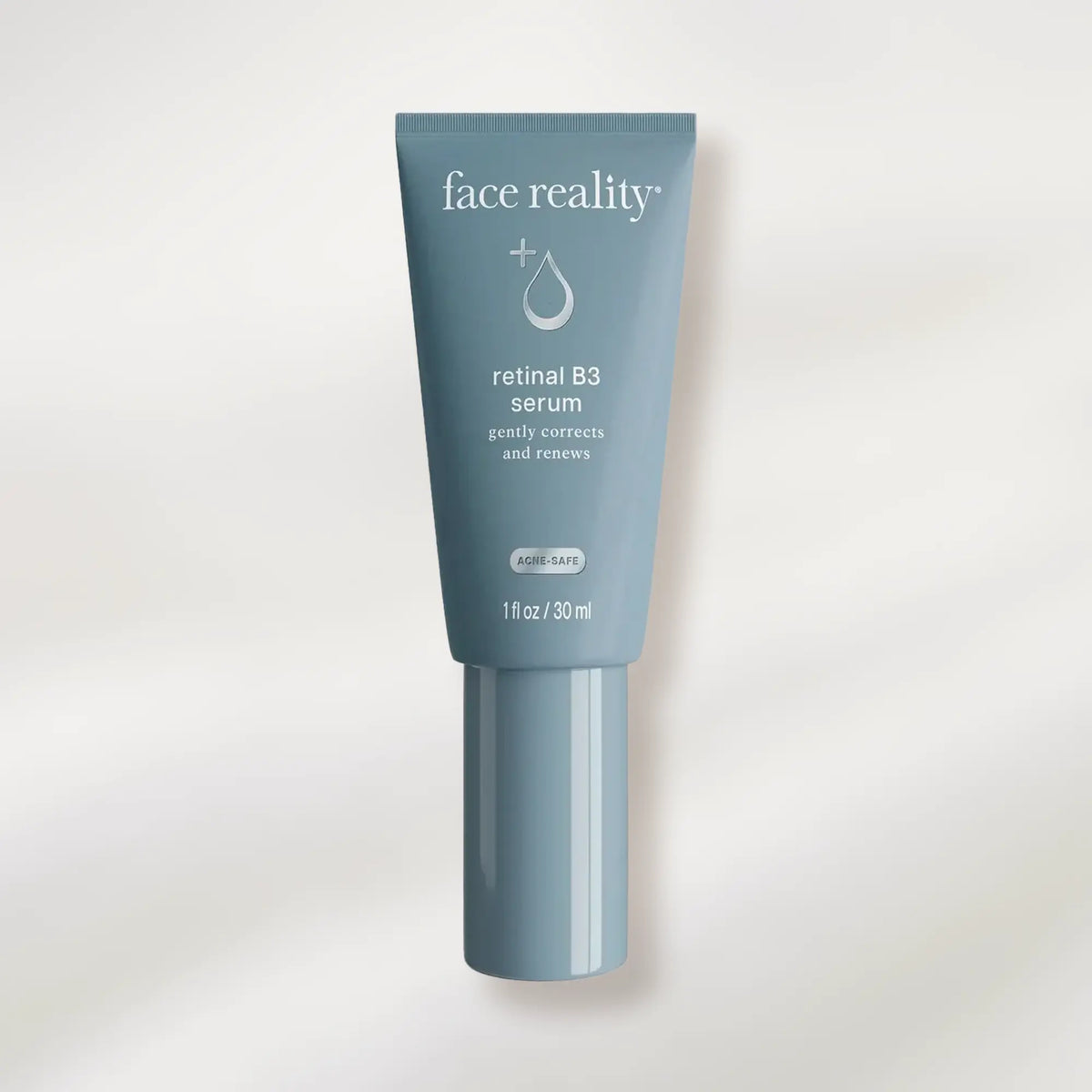 Tube of face reality retinal B3 serum on a white background