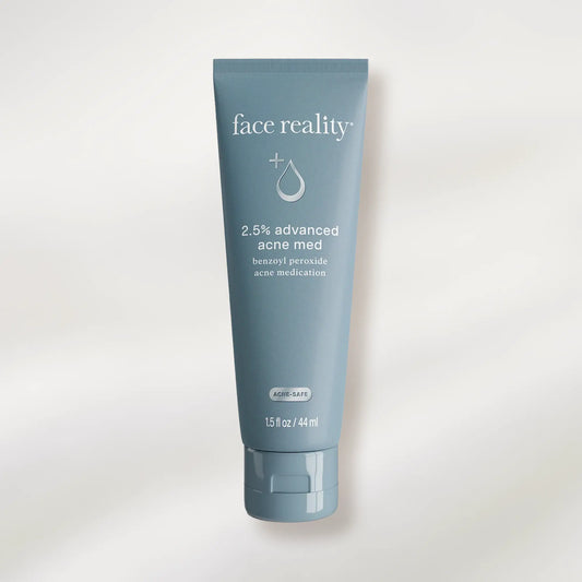 Tube of 'face reality' acne medication on a white background