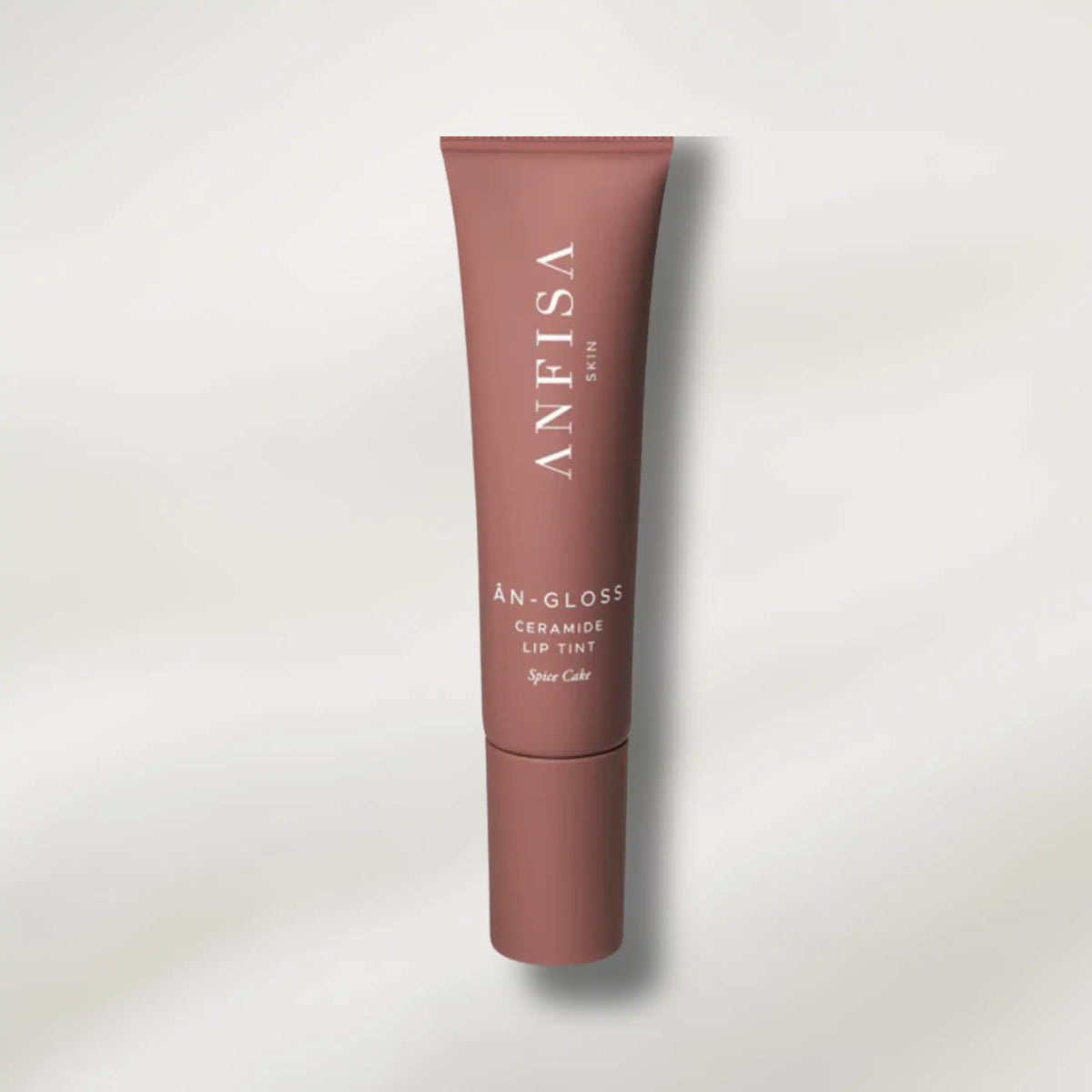 Lip tint tube with 'ANFISA' branding on a light gray background