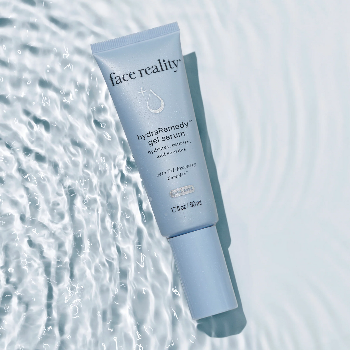 Tube of 'face reality' hydraRemedy gel serum on a water-like background