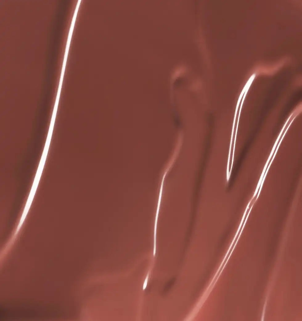 Close-up of a smooth, glossy brown surface