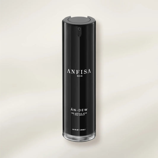 Black skincare serum bottle labeled 'ANFISA' on a light beige background