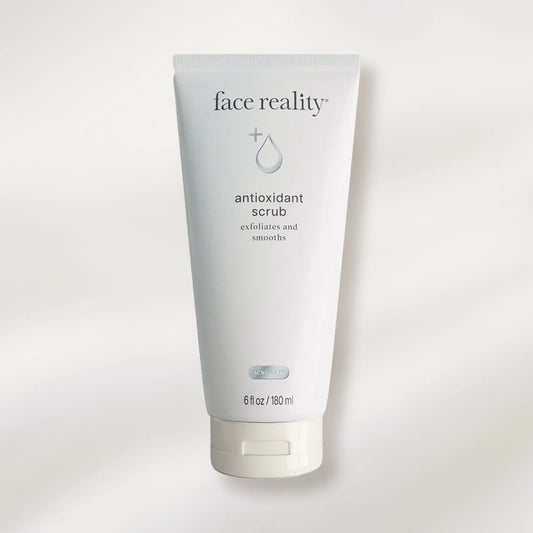 Tube of 'face reality' antioxidant scrub on a white background