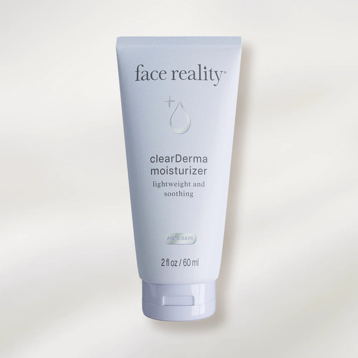 Tube of face reality clearDerma moisturizer on a white background
