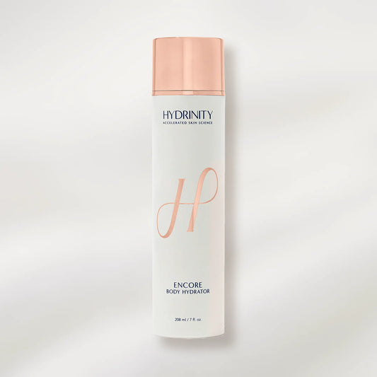 Hydrinity Encore Body Hydrator bottle with rose gold cap and design on a light gray background