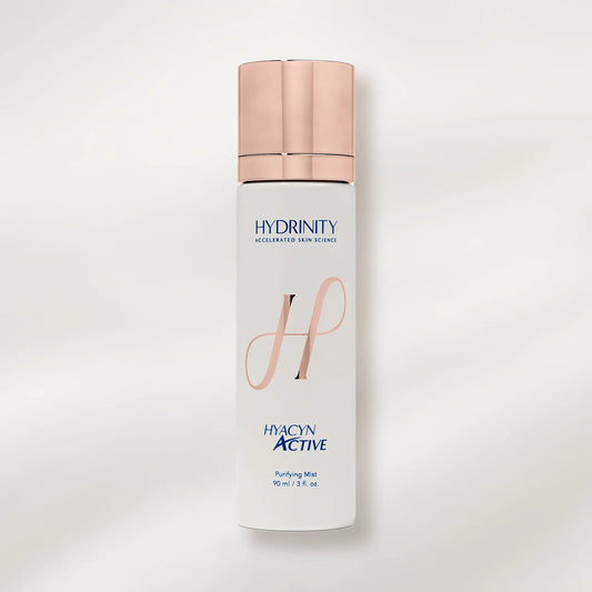 Skincare bottle with 'Hydrinity' branding on a white background