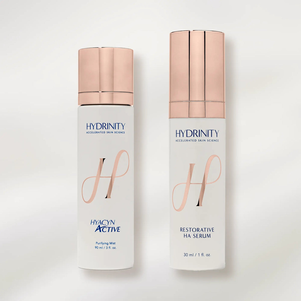 Two skincare bottles from Hydrinity on a white background