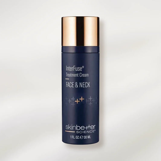 Blue skincare bottle with gold cap on a light gray background