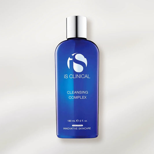 Blue bottle of IS Clinical Cleansing Complex on a light gray background