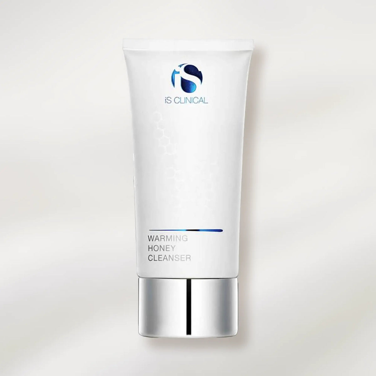 Skincare cleanser tube labeled 'Warming Honey Cleanser' on a white background
