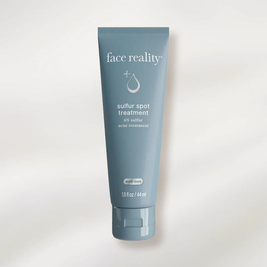 Tube of 'face reality' sulfur spot treatment on a white background