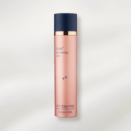 Skincare bottle with pink body and navy cap on a light gray background