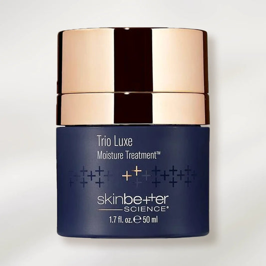 Skincare product jar labeled 'Trio Luxe Moisture Treatment' by 'skinbetter science' on a light background